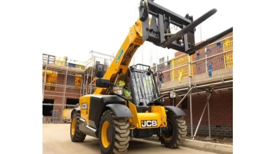 A yellow and black crane truck parked on the street